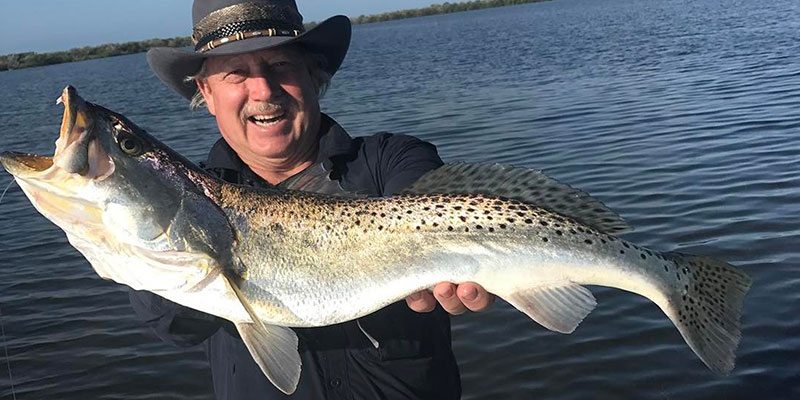 Man holding tarpon at the Port Canaveral Fishing Charter